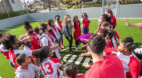Group of youth athletes in red jerseys gathered for training at SaveMax Fieldhouse, part of Fusion Sports Park’s Phase 1B high-performance school program with TFC.