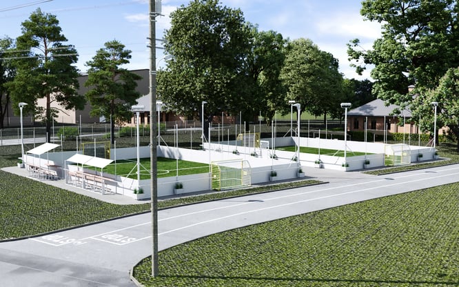 Outdoor community soccer courts with spectator seating at a modern sports facility
