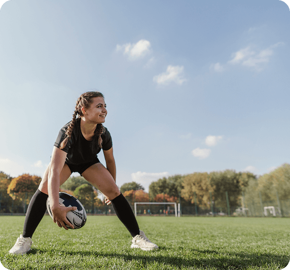 Young female athlete training on the field, highlighting women's sports participation at Fusion Sports Park