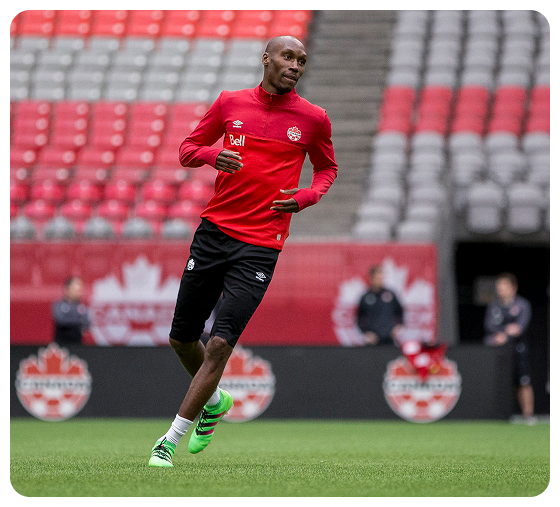 Atiba Hutchinson training in Canada gear, representing elite athlete leadership at Fusion Sports Park